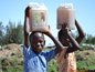 Household Water Treatment - boys carrying water in Africa