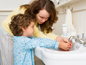 Hygiene - picture of mom teaching child how to wash hands