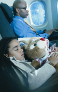 Photo: A boy sleeping on an airplane.