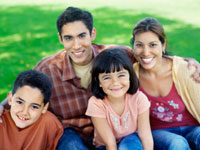 Photo: Young Hispanic family smiling
