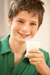Photo: A boy with a glass of milk.