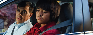 Photo: A young driver with his father