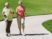 Photo: Two seniors walking on a concrete path