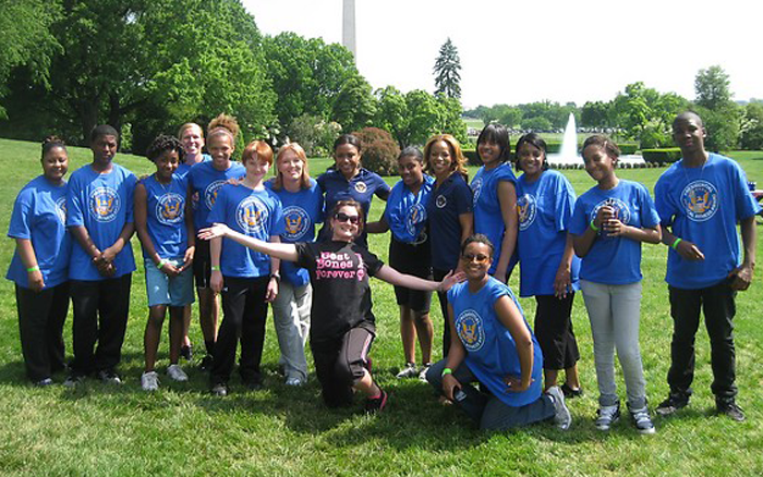 5. White House Event CaptionPresident's Council members Donna Richardson Joyner and Dominique Dawes pose with families and Best Bones Forever! team member Darcy Sawatzki.