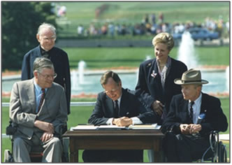 President Bush signing the ADA into law