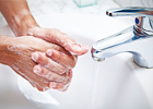 A person washing their hands 