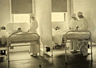 Nurses tend to sick patients in a hospital during the 1918 flu pandemic