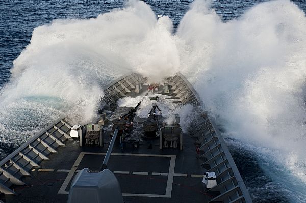The bow of the Ticonderoga-class guided-missile cruiser USS Cowpens (CG 63) plows through a wave while underway in rough seas. Cowpens is part of the George Washington Carrier Strike Group, forward deployed to Yokosuka, Japan, and is currently conducting a routine patrol in the western Pacific region.  U.S. Navy photo by Mass Communication Specialist 3rd Class Paul Kelly (Released)  120926-N-TX154-064