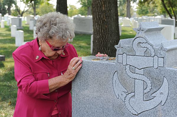 Ima Black, widow of the first Master Chief Petty Officer of the Navy (MCPON), Delbert Black, visits the grave of her late husband. Black will attend the MCPON change of command ceremony scheduled for Sept. 28 at the Washington Navy Yard.  U.S. Navy photo by Mass Communication Specialist 1st Class Arif Patani (Released)  120927-N-PM781-215