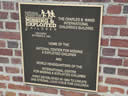 Plaque marking the home of the National Center for Missing and Exploited Children and the location of the press conference.