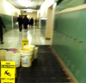 Picture of buckets catching leaking water