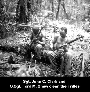 Seargant John C. Clark and Staff Seargant Ford M. Shaw clean their rifles
