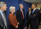 a photo of President Obama, Secretary Sebelius, Dr. Collins, Deputy Secretary Corr, and Dr. Holdren talking in a group.