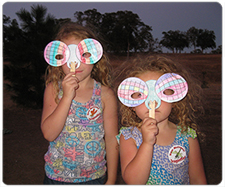 Photo of Girls with dragonfly masks.