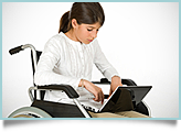 young girl in wheel chair with laptop