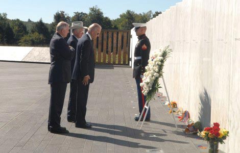 Vice President Biden, Secretary Salazar, and President of the Families of Flight 93, Patrick G. White, pause after laying a wreath at The Wall of Names at the Flight 93 National Memorial.