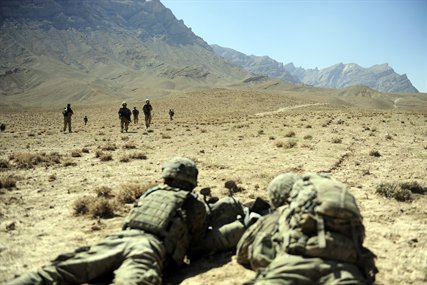U.S. troops pull security as their teammates from Provincial Reconstruction Team Farah approach the landing zone during a mission in Pur Chaman district, Farah province, Afghanistan, Sept. 26, 2012. 