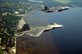 An F-35A Lightning II joint strike fighter from the 33rd Fighter Wing at Eglin Air Force Base, Fla., and an F-22A Raptor from the 325th Fighter Wing at Tyndall Air Force Base, Fla., soar over the Emerald Coast Sept. 19, 2012. The flight marked  the first time the two fifth-generation fighters have flown together for the Air Force. U.S. Air Force photo by Master Sgt. Jeremy T. Lock