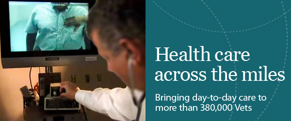 Health care across the miles: bringing day-to-day care to more than 380,000 Vets. Image of a doctor adjusting volume below a TV screen showing a Veteran patient