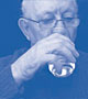 Image of an elderly man is drinking water.