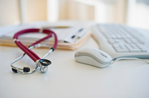 image of stethoscope on computer keyboard