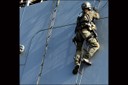 An FBI SWAT operator boards a cargo ship during an annual maritime training exercise in San Francisco Bay in April 2012. These specific types of training exercises are designed to hone the abilities of FBI SWAT team members in the event of a terrorist attack, hostage situation, or any other criminal or national security threat occurring in domestic sea lanes.