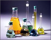 Photo of various sizes and shapes of beakers containing different types of fuel.