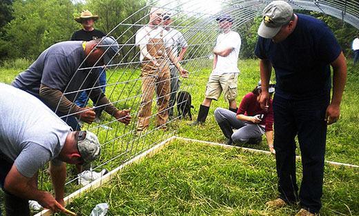 Military veterans-turned-beginning-farmers learn how to build mobile poultry units at an Armed to Farm workshop at the University of Arkansas in Fayetteville, AR.