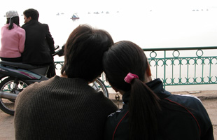 A young couple at West Lake, Hanoi, Viet Nam.