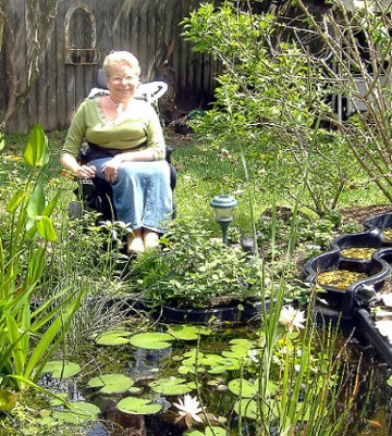 Peg Nosek in her
spring watergarden, March 2007 