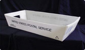A picture of a 1 foot by 2 foot white plastic tray with 'United States Postal Service' written on it