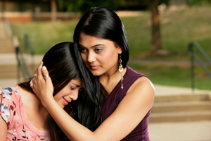 woman comforting another woman