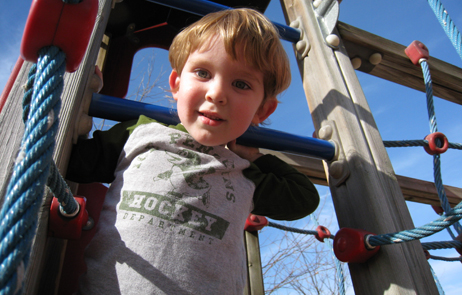 photo of boy on playground
