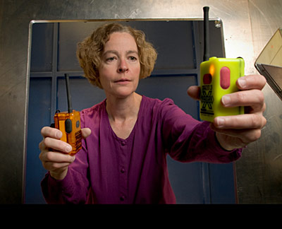 K. Remley holding personal alert safety system devices