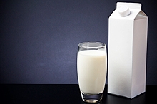 A glass and carton of milk