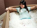 Image of girl in a box of shipping foam