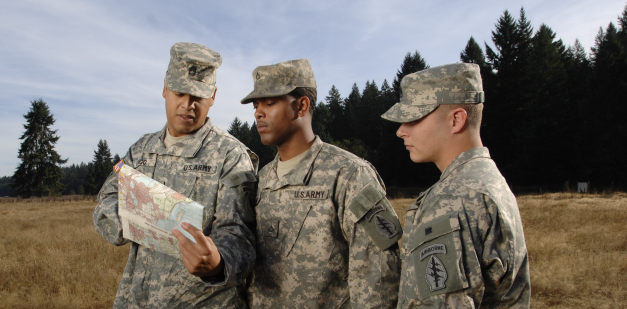 Soldiers reading a map.