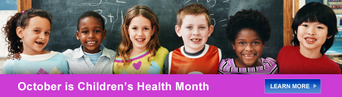Childen standing in front of chalkboard - October is Children's Health Month