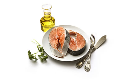 raw salmon steaks on a plate