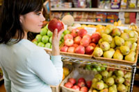 Photo: Woman shopping for apples