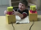 Image of a young boy with blocks as part of an experiment at the University of Texas at Austin.