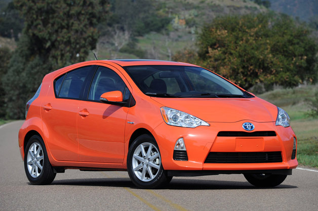 2013 Toyota Prius C - front three-quarter view - orange