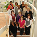 Twelve Cleveland Champions women stand on a staircase together.