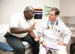Dr. Carson talks with patient Lyle Bryant