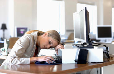 Woman sleeping at desk