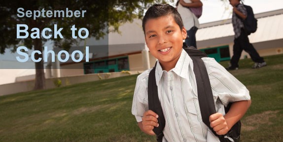Back to School - smiling young boy wearing backpack