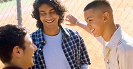 Group of three teen boys having a conversation