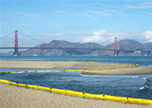 Oil booms line Rode0 Beach in San Francisco, California. 