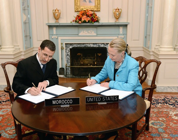 Secretary Clinton (r) and Moroccan Foreign Minister Al-Otmani (l) signing agreements at the opening plenary of the first U.S.-Morocco Strategic Dialogue in the Franklin Room at the State Department.