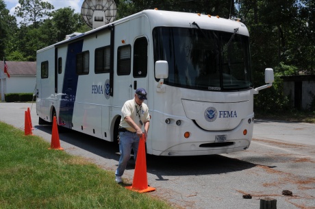  Mobile Communications Office Vehicle (MCOV) Operator Bill Fader is set up at the Wakulla County FEMA/State Disaster Recovery Center where this vehicle provides tele-communication services for workers inside the building. FEMA is here in response to Tropical Storm Debby. George Armstrong/FEMA 